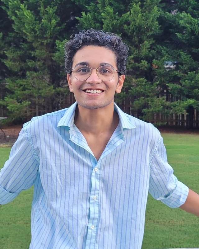 Portrait of Anam Sanghavi outdoors on a summer evening